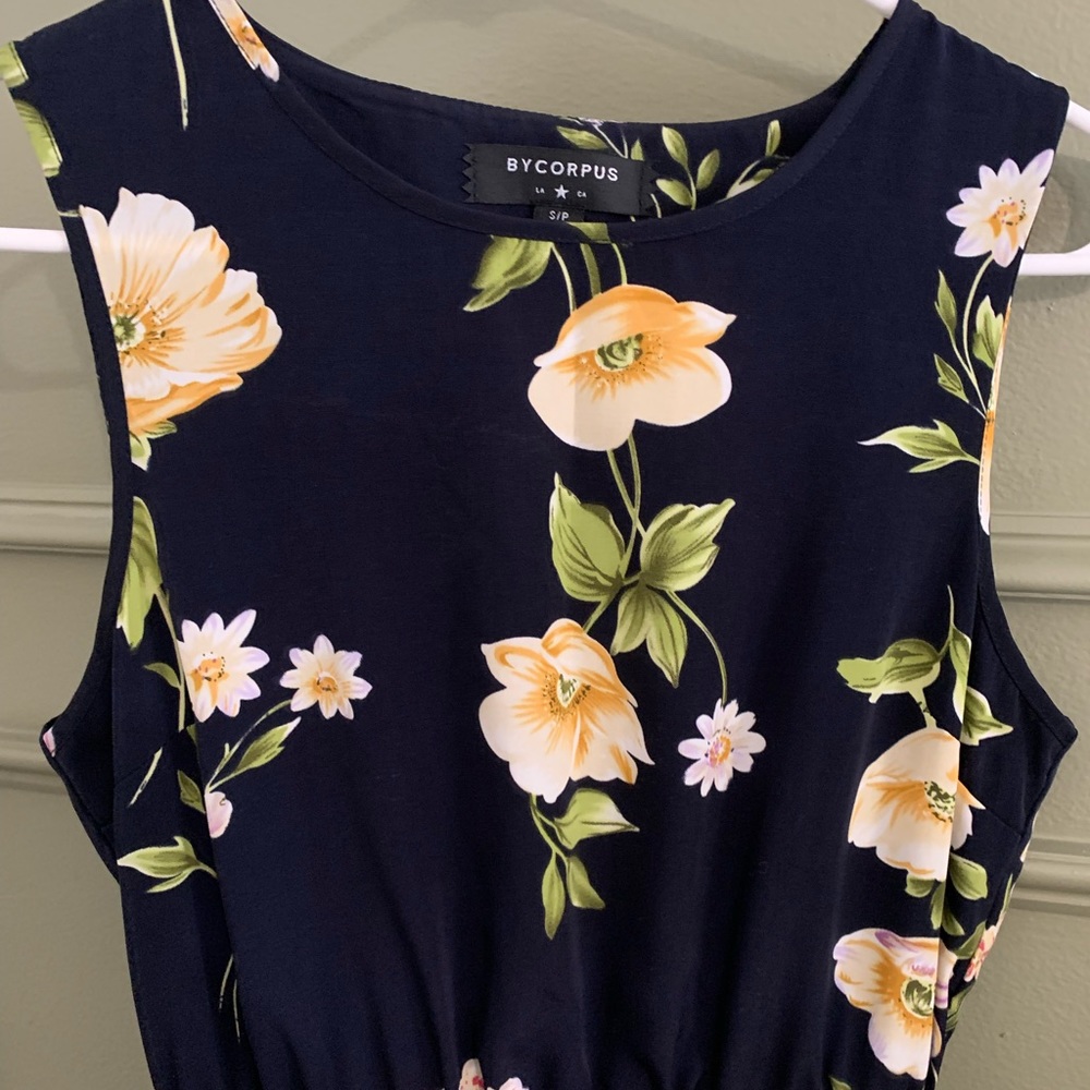 Size small navy and floral dress with elastic waist band and keyhole back.